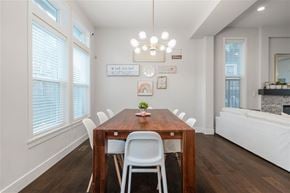 Surrey apartment for rent - A dining room with a wooden table and white chairs.