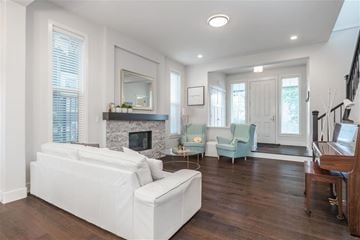 Surrey apartment for rent - A living room with a white couch and a fireplace.