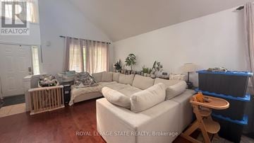Hamilton apartment for rent - A living room with a white couch and a wooden stool.