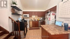 Hamilton apartment for rent - A kitchen with a counter and a calendar on the wall.