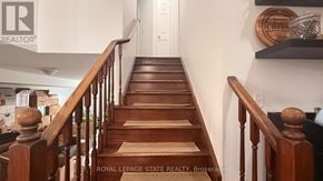 Hamilton apartment for rent - A staircase with wooden steps and handrails.