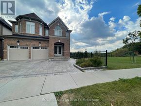 Cambridge apartment for rent - A large house with a driveway in front of it.