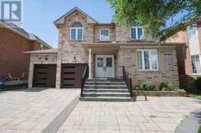 Newmarket (Woodland Hill) apartment for rent - A brick house with a front porch and a garage door.