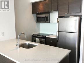 Toronto (Henry Farm) condo for rent - A kitchen with a sink and a refrigerator.