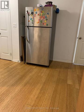 Toronto (Bay Street Corridor) house for rent - A refrigerator with magnets on it in a kitchen.