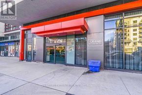 Mississauga (Creditview) condo for rent - The entrance to a building with a red awning and glass doors.