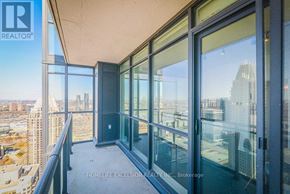 Mississauga (Creditview) condo for rent - A balcony with glass doors overlooking a cityscape.
