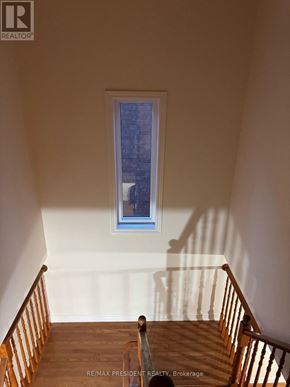 Hamilton (Stoney Creek) apartment for rent - A staircase with a window above it.