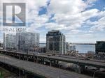 Toronto (Waterfront Communities) condo for rent - A bridge over a body of water with a building under construction in the background.