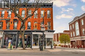 Hamilton (Beasley) apartment for rent - A street view of a city with buildings, trees, and a traffic light.