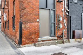 Hamilton (Beasley) apartment for rent - A red brick building with a white door and windows.