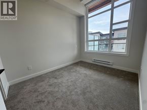 Maple Ridge apartment for rent - A room with a window overlooking a building.
