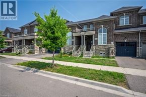 Milton townhouse for rent - A row of houses with a REALTOR® logo in the corner.