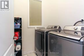 Wasaga Beach townhouse for rent - A kitchen with a microwave and oven.