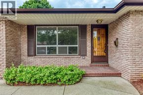 Oakville apartment for rent - A house with a brown door and window.