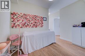 Mississauga condo for rent - A room with a bed and a chair.