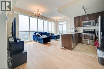 Mississauga condo for rent - A living room with a couch and a television.