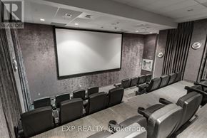 Ottawa condo for rent - A conference room with a large screen and chairs.