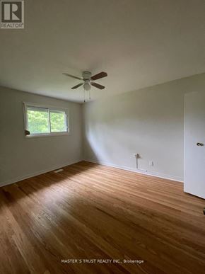 Toronto (West Hill) apartment for rent - A room with a ceiling fan and wooden flooring.
