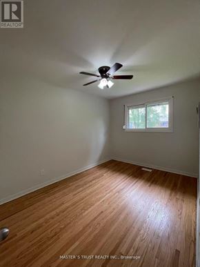 Toronto (West Hill) apartment for rent - A room with a ceiling fan and wooden flooring.
