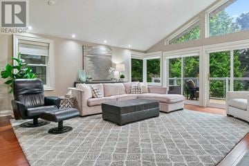 Mississauga (Lorne Park) apartment for rent - A well-lit living room with a grey rug and a large window.