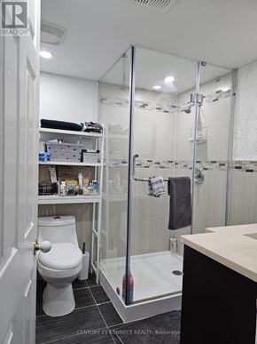 Brampton (Heart Lake East) apartment for rent - A bathroom with a toilet, sink, and shower.