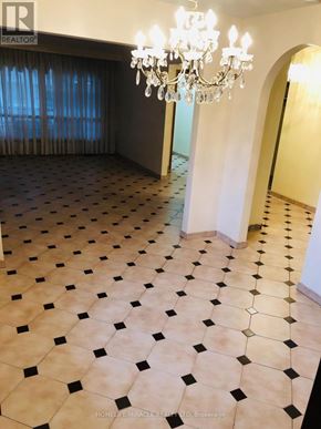Toronto (Kingsview Village-The Westway) apartment for rent - A large room with a chandelier and a checkered floor.
