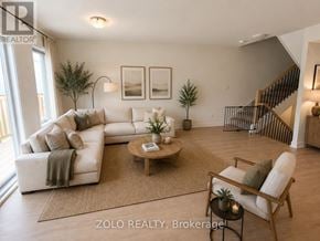 Smiths Falls townhouse for rent - A living room with a white couch and a coffee table.