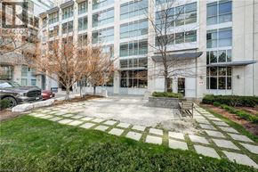 Mississauga condo for rent - A large building with a sign that says "REALTOR" on the side.