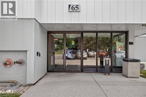 Guelph condo for rent - The building is number 165 and is a realtor office.
