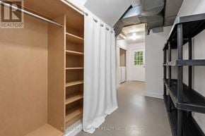 London North (North P) townhouse for rent - A long hallway with a white curtain and shelves on the side.