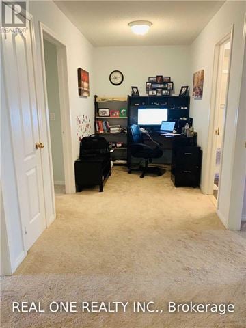Mississauga (Churchill Meadows) townhouse for rent - A room with a desk, chair, and a bookshelf.