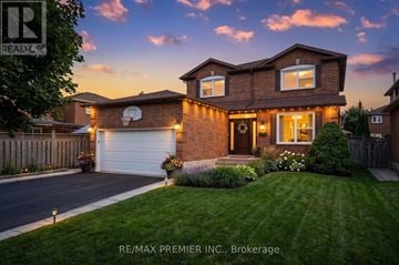 Vaughan (Maple) apartment for rent - A house with a garage and a driveway is shown.