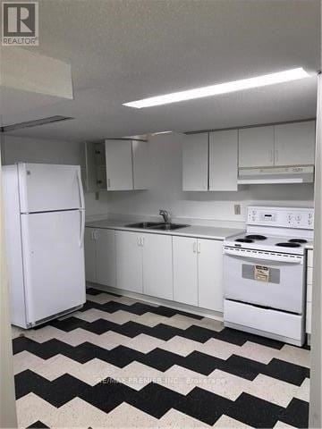 Vaughan (Maple) apartment for rent - A black and white checkered floor in a kitchen with white appliances.