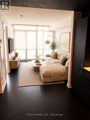 Toronto (Waterfront Communities) condo for rent - A modern living room with a large window and a white sofa.