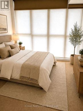 Toronto (Waterfront Communities) condo for rent - A bedroom with a large bed and a small tree on the nightstand.