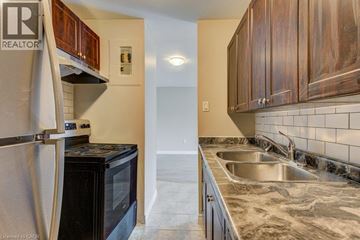 London apartment for rent - A kitchen with a sink and a refrigerator.