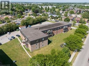 London apartment for rent - An aerial view of a large apartment complex with a parking lot in front.
