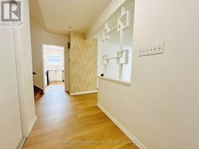 Toronto (Willowdale East) apartment for rent - A hallway with wooden floors and white walls.