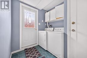 St. Catharines (Lakeport) apartment for rent - A laundry room with a washer and dryer.