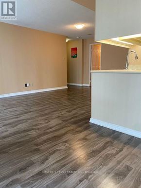 Toronto (Bay Street Corridor) condo for rent - A room with wooden flooring and a white counter.
