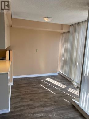 Toronto (Bay Street Corridor) condo for rent - A room with wooden flooring and a window with white curtains.
