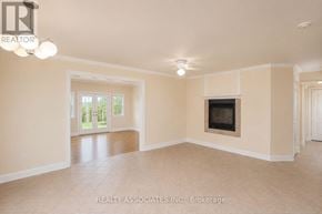 Georgina (Keswick South) apartment for rent - A spacious living room with a fireplace and sliding glass doors.