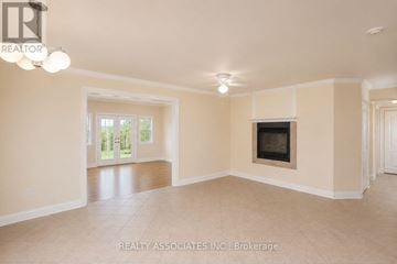 Georgina (Keswick South) apartment for rent - A spacious living room with a fireplace and sliding glass doors.