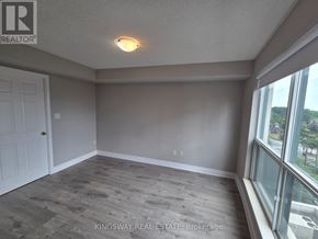 Toronto (Willowdale West) condo for rent - A room with a door, window, and a light on the ceiling.