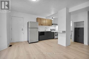 St. Thomas fourplex for rent - A well-lit, modern kitchen with wooden cabinets and stainless steel appliances.