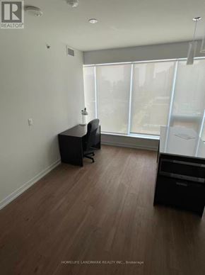 Toronto (Kensington-Chinatown) condo for rent - A room with a desk and a chair in it.