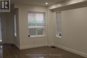 Mississauga (East Credit) apartment for rent - A room with a chandelier and a wall with a logo that says REALTOR.