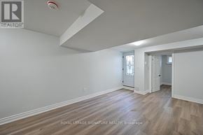 Ajax (Northwest Ajax) apartment for rent - A room with a wooden floor and white walls.