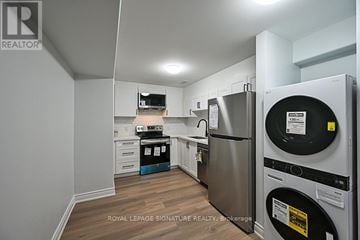 Ajax (Northwest Ajax) apartment for rent - A kitchen with a refrigerator and a washing machine.